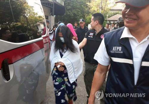 태국 경찰에 대리 출산 및 장기밀매 가담 혐의로 체포된 여성[EPA=연합뉴스 자료 사진]